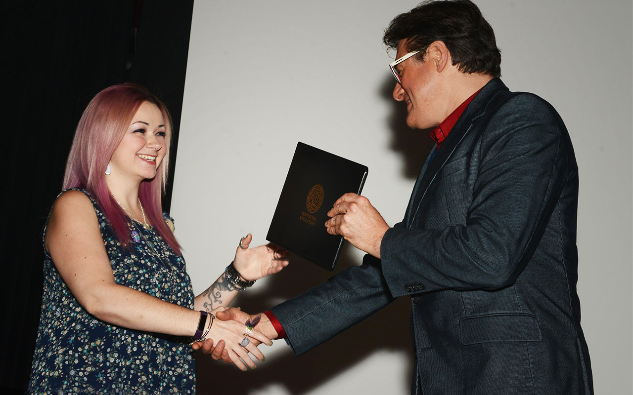 RISD|CE certificate graduate receives her certificate