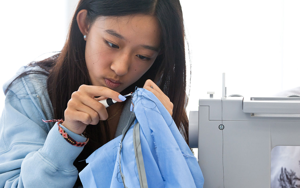 RISD CE teen online courses - photo of student sewing
