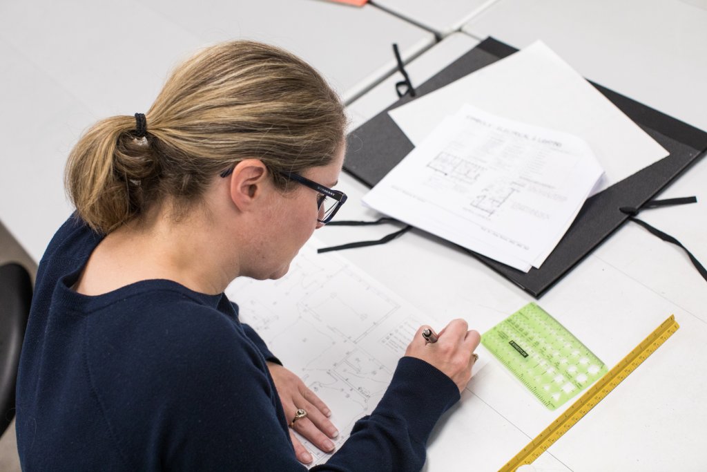 student working on technical drawing