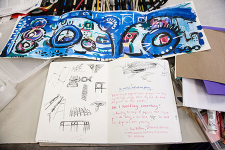 students drawing with charcoal in studio